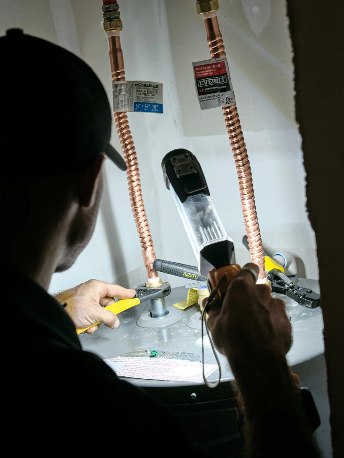 HVAC technician installing water heater