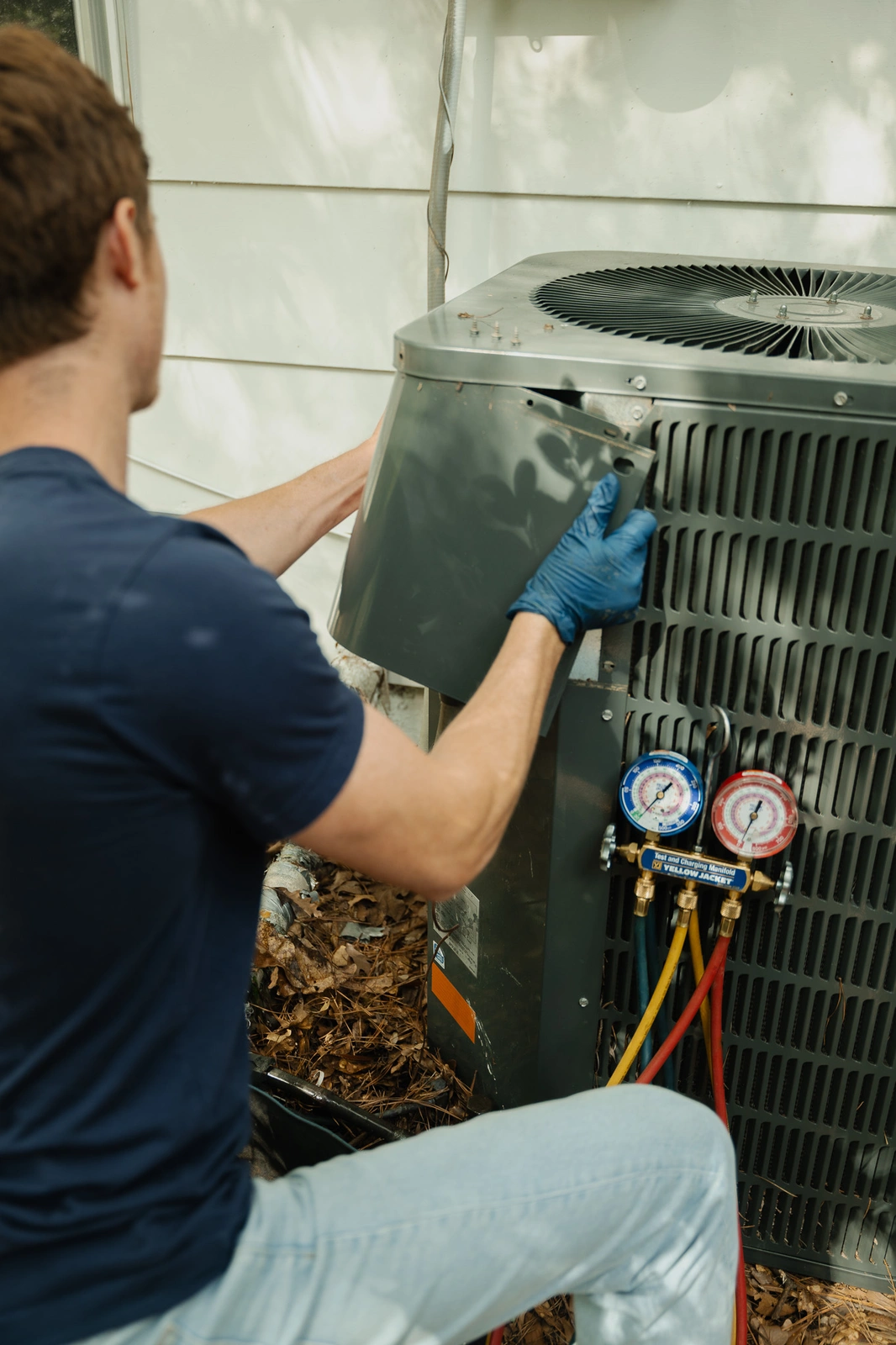 Air conditioning repair by a Rooted Heating & Air technician